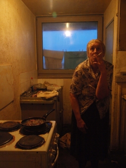 Sylvia prepares diner in her kitchen